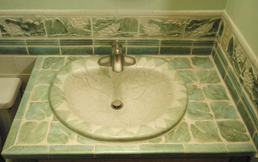Sink with matching countertop and backsplash.